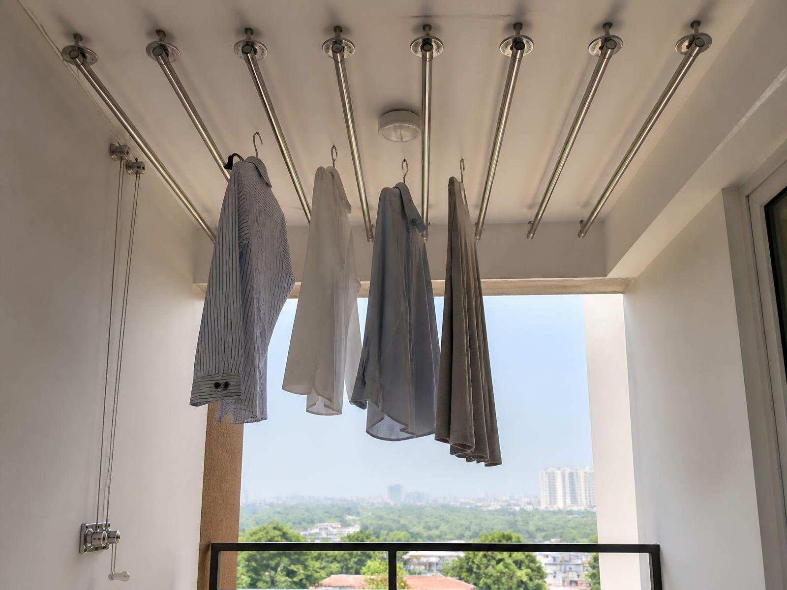 Small balcony with a compact ceiling cloth hanger and clear floor after installation