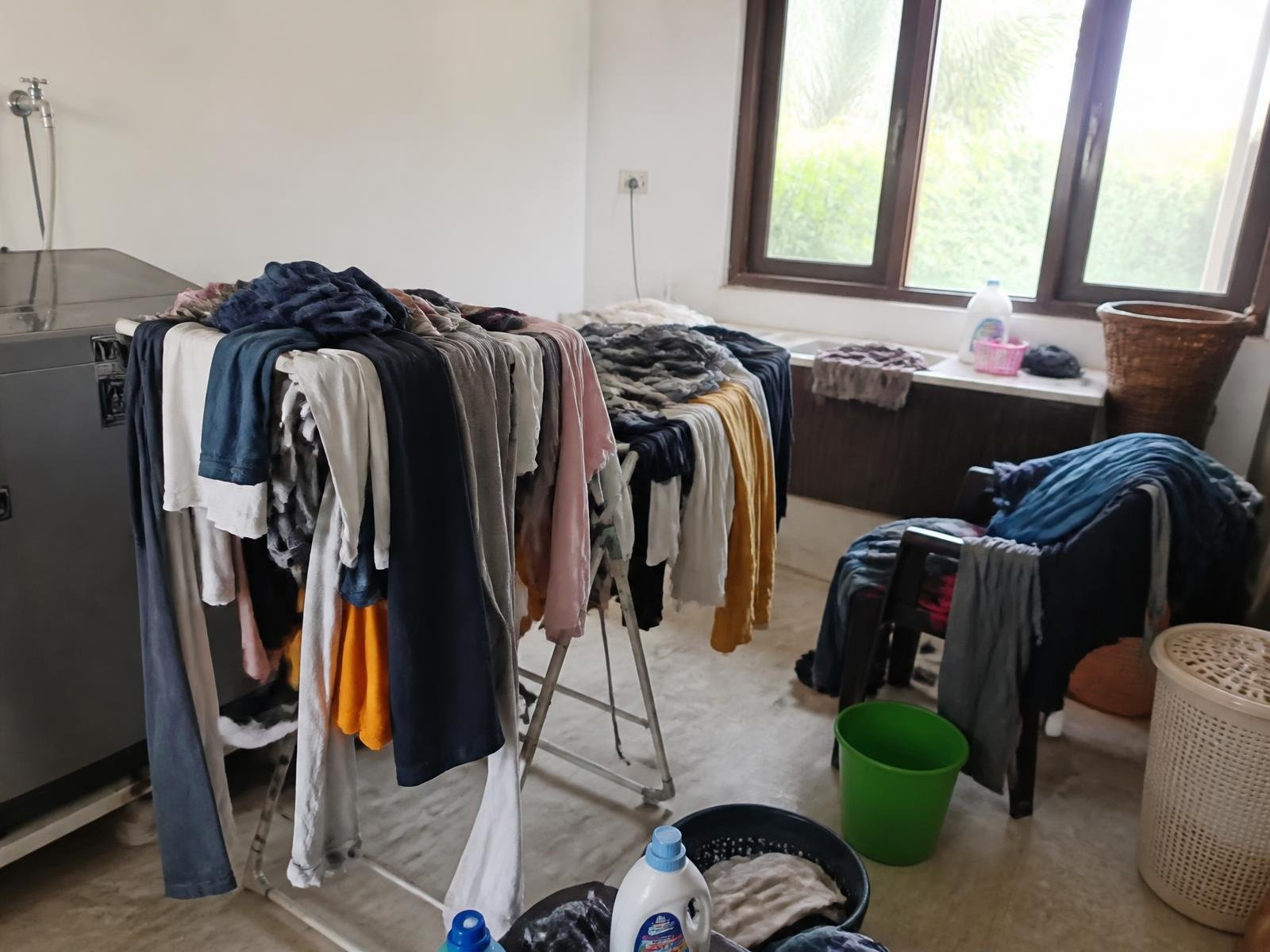 Villa utility room with clothes piled everywhere before installation