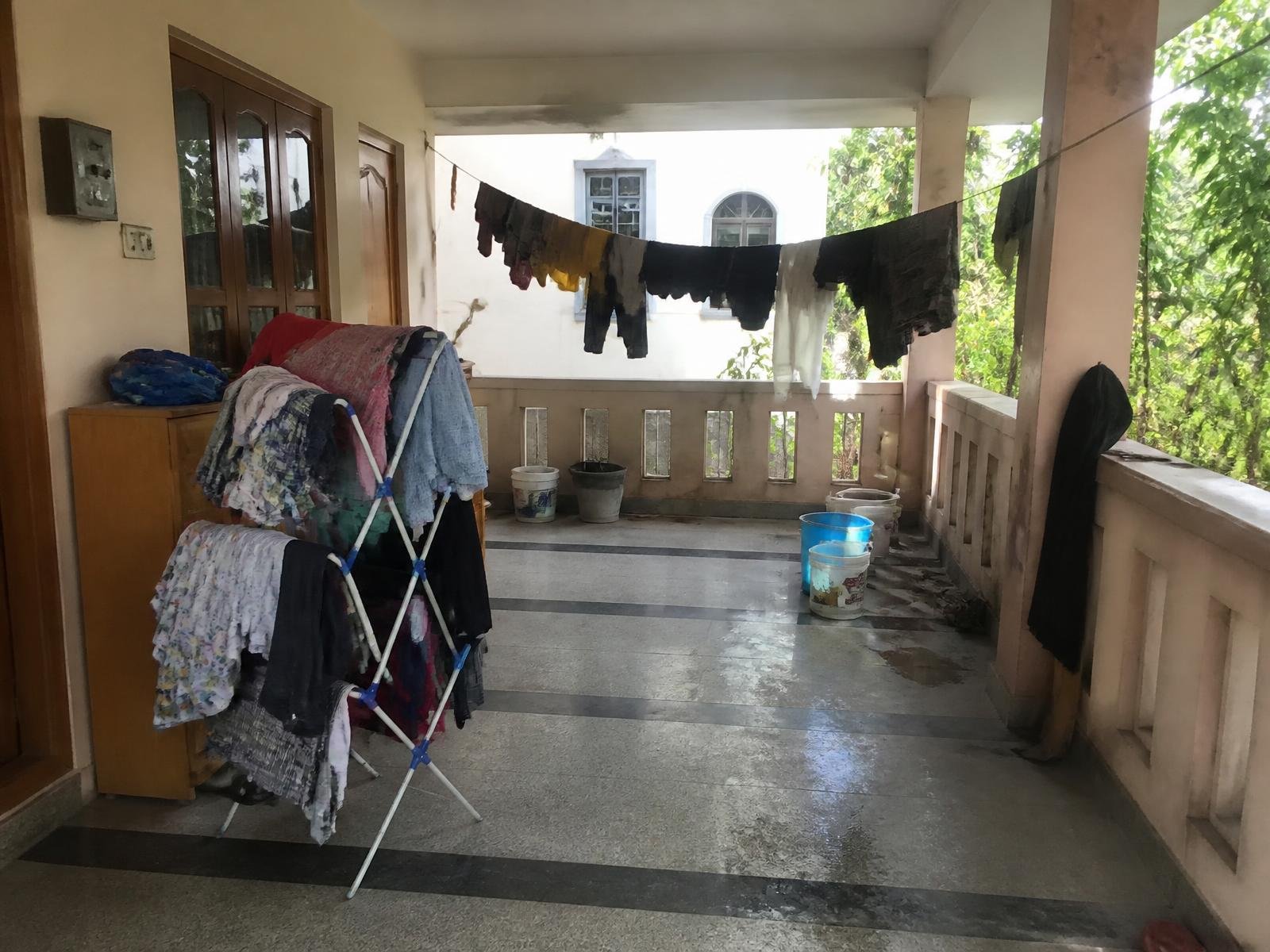 Verandah of an independent house with a sagging clothesline before installation